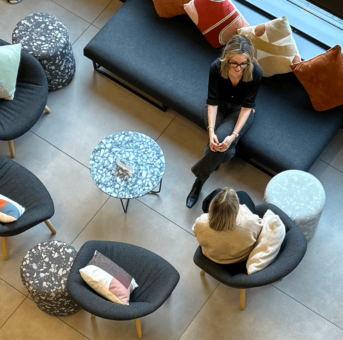 View from above reception area showing two women talking